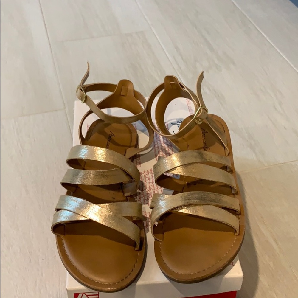 Gold strappy flat sandal